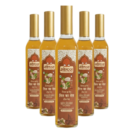 Five bottles of Shwetras oil with gold caps on a white background