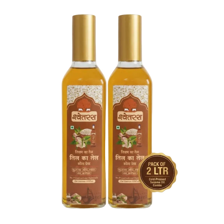 Two bottles of Shwetras oil with gold caps on a white background
